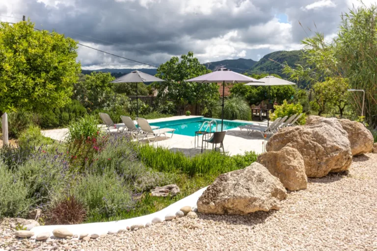 Garden with rocks, lavender and the pool