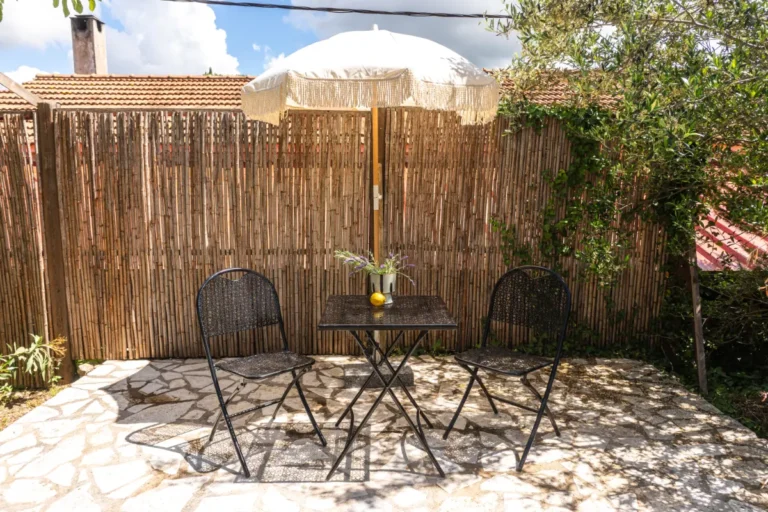 Bistro table and chairs on a stone terrace