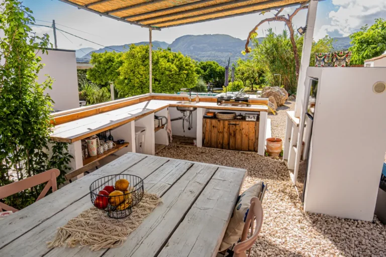 Outdoor kitchen with dining table