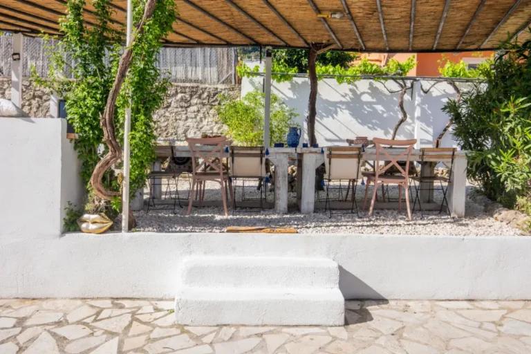 Shaded dining terrace under a pergola