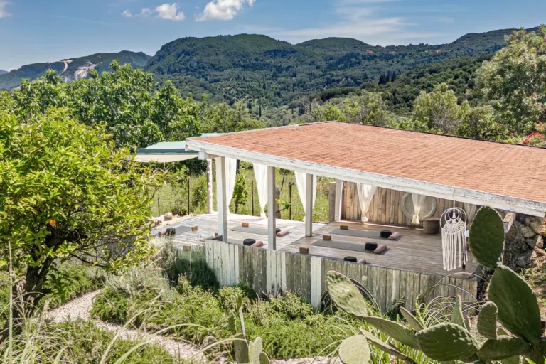 Yoga shala at Manto Corfu surrounded by greenery with views of the hills