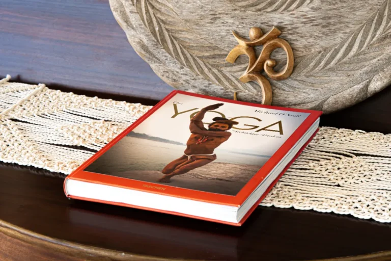 Yoga book and Om figure on a lace tablecloth