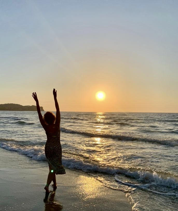 A women near a beach during sunset