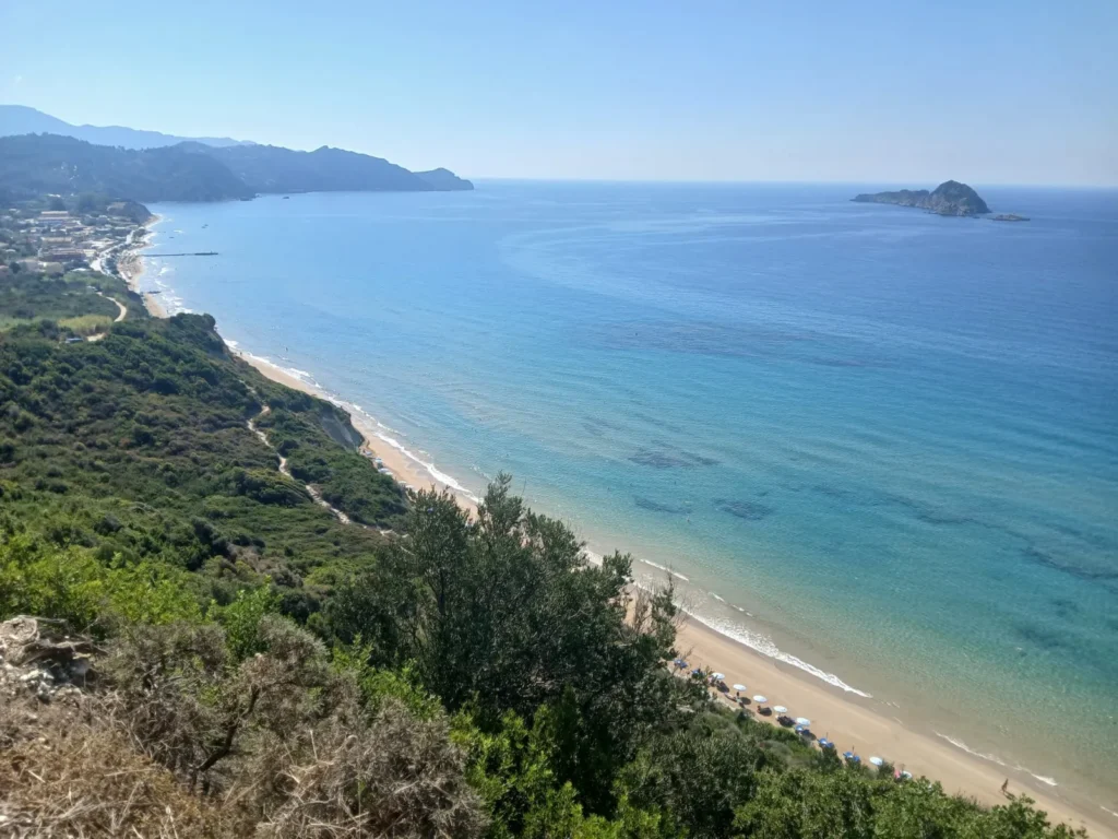 A long sandy bay on the northwest coast of Corfu seen from the hillside trail